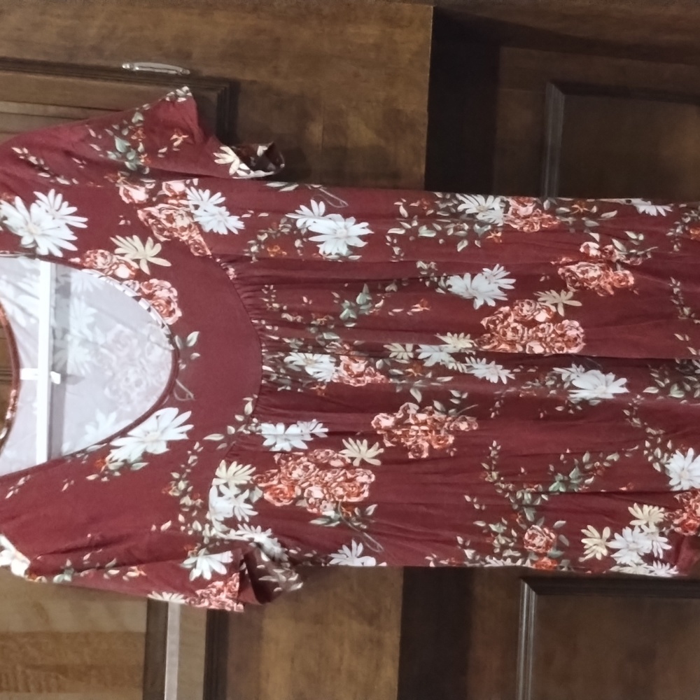 Marroon floral print shirt.